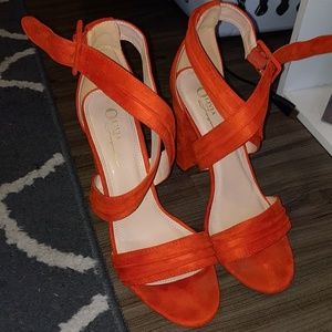 Strappy orange block heels